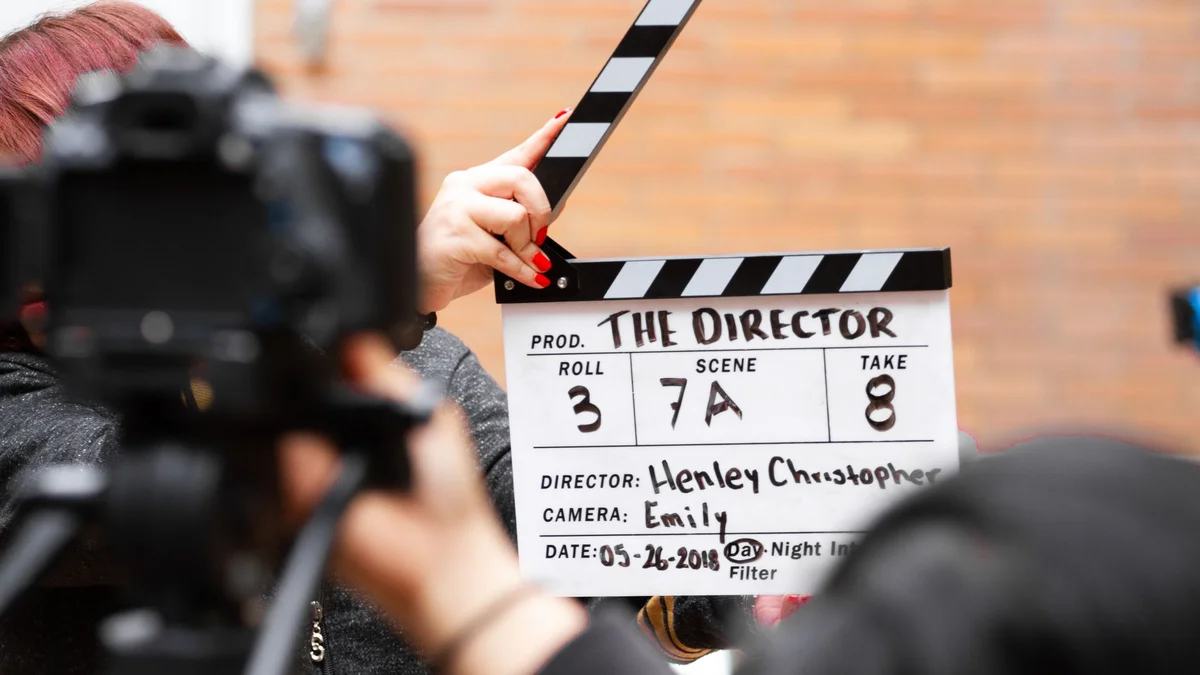 Clap of cinema in front of a camera on a shooting, symbol of video production